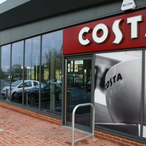 A costa coffee shop with parked cars in front of it, showcasing KSF Non-thermal Shop Fronts.