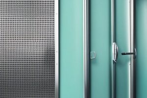 A metal door with perforated panels and a door handle.